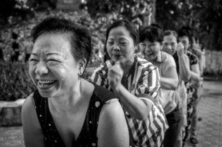 Black and White photo by Graeme Heckels Hanoi Street Photography Smile Train_Massage a Friend