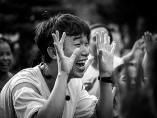 Black and White photo by Graeme Heckels Hanoi Street Photography Laughing Yoga Guru