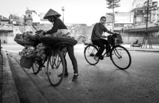 Black and White photo by Graeme Heckels Hanoi Street Photography Hot Wheels Bicycle Motorbike Vietnam