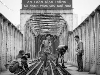 Black and White photo by Graeme Heckels Hanoi Street Photography Railway Workers