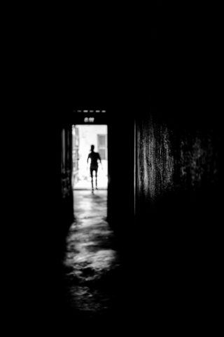Black and White photo by Graeme Heckels Hanoi Street Photography Ghostly Silhouette