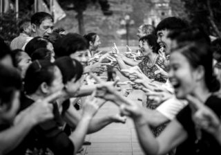 Black and White photo by Graeme Heckels Hanoi Street Photography Laughing Yoga